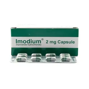 A blister pack of Imodium Capsule 2mg with text indicating its uses, formula, side effects, and price.
