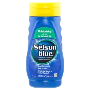 A bottle of Selsun Blue shampoo with a white cap against a blue background.
