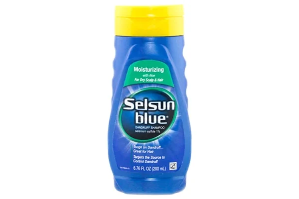 A bottle of Selsun Blue shampoo with a white cap against a blue background.