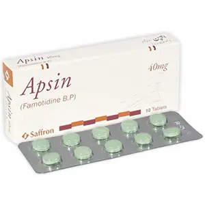 A blister pack of Aspin tablets with a label displaying its uses, ingredients, side effects, dosage, and price.
